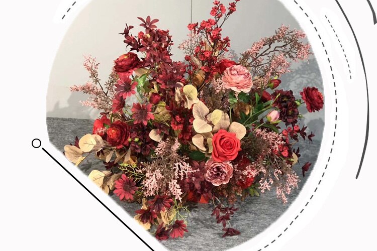 Creating a visually appealing arrangement with artificial flowers on cake
